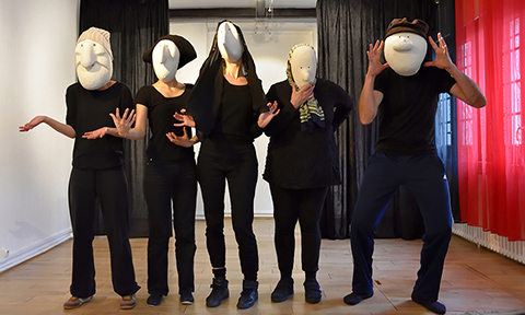 group picture of students with larval masks during the workshop